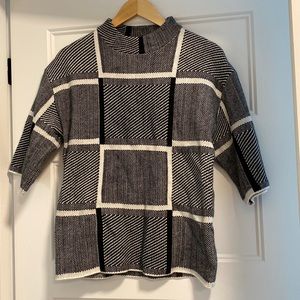 Black and white knit mock-neck sweater
